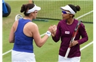 BIRMINGHAM, ENGLAND - JUNE 15:  Raquel Kops-Jones and Abigail Spears (L) of the United States celebrate during the Doubles Final during Day Seven of the Aegon Classic at Edgbaston Priory Club on June 15, 2014 in Birmingham, England.  (Photo by Tom Dulat/Getty Images)